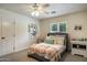 Cozy bedroom with a comfortable bed, plush pillows, and ample natural light streaming through the window at 5501 N 1St St, Phoenix, AZ 85012