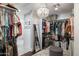 Spacious walk-in closet with ample hanging space, storage, and a decorative chandelier at 5501 N 1St St, Phoenix, AZ 85012