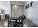 Cozy dining nook with banquette seating, pendant light, and access to kitchen and dining areas at 5501 N 1St St, Phoenix, AZ 85012