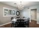 Elegant dining room features a chandelier, dark wood floors, and a round table with black chairs at 5501 N 1St St, Phoenix, AZ 85012