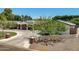 Inviting single-story home with a brick facade and well-manicured landscaping at 5501 N 1St St, Phoenix, AZ 85012