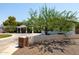 Traditional home with a circular driveway, brick accents, and lush landscaping at 5501 N 1St St, Phoenix, AZ 85012