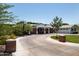 Charming brick home featuring circular driveway, basketball court, and a welcoming front porch at 5501 N 1St St, Phoenix, AZ 85012
