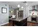 Modern kitchen with stainless steel appliances, gas range, kitchen island and white cabinets at 5501 N 1St St, Phoenix, AZ 85012