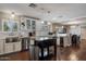 Open-concept kitchen with stainless steel appliances, a kitchen island and a dining area at 5501 N 1St St, Phoenix, AZ 85012
