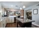 Spacious kitchen featuring a central island, wine cooler, and seamless flow to the living area at 5501 N 1St St, Phoenix, AZ 85012