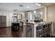 Bright kitchen showcases stainless steel appliances, an island with seating, and pendant lighting at 5501 N 1St St, Phoenix, AZ 85012