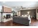 Spacious living room with a brick fireplace, hardwood floors, and comfortable seating at 5501 N 1St St, Phoenix, AZ 85012