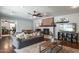 Comfortable living room with hardwood floors, a fireplace, and a view into the kitchen at 5501 N 1St St, Phoenix, AZ 85012