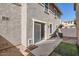 Home backyard with sliding glass door, small dog door, and low-maintenance gravel at 5828 E Hampton Ave, Mesa, AZ 85206