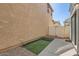 Low-maintenance backyard featuring a patio and artificial grass dog run at 5828 E Hampton Ave, Mesa, AZ 85206