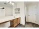 Bright bathroom with a long vanity counter, carpet floors, and a connected toilet room at 5828 E Hampton Ave, Mesa, AZ 85206