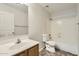 Clean bathroom with a shower-tub, white sink, and dark wood cabinets at 5828 E Hampton Ave, Mesa, AZ 85206