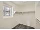 Well-organized walk-in closet offering ample storage space and natural light at 5828 E Hampton Ave, Mesa, AZ 85206