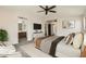 Serene primary bedroom with ensuite bathroom, modern decor, and comfortable seating area at 5828 E Hampton Ave, Mesa, AZ 85206