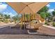 Shaded community playground featuring slides, ladders, and rubber mulch ground cover at 5828 E Hampton Ave, Mesa, AZ 85206