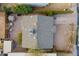 Aerial view of a single Gathering residence features a backyard, gravel landscaping, and composition shingle roof at 660 E 1St Ave, Mesa, AZ 85204