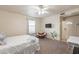 Bedroom with carpet, ceiling fan, and a view of a door and study area at 660 E 1St Ave, Mesa, AZ 85204