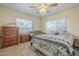 Inviting bedroom with ample natural light, a ceiling fan, and a cozy sitting area at 660 E 1St Ave, Mesa, AZ 85204