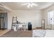 Cozy bedroom features a workspace with white desk, decor ladder, and mini refrigerator for comfort and convenience at 660 E 1St Ave, Mesa, AZ 85204