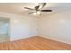 Bright bedroom features wood-look floors and a ceiling fan with integrated lighting at 660 E 1St Ave, Mesa, AZ 85204
