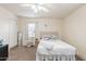 Comfortable bedroom with carpet, a ceiling fan, and a cozy atmosphere at 660 E 1St Ave, Mesa, AZ 85204