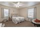 Cozy bedroom with carpet, a ceiling fan, and windows offering natural light at 660 E 1St Ave, Mesa, AZ 85204