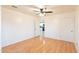 Bright bedroom features wood-look floors and a ceiling fan with integrated lighting at 660 E 1St Ave, Mesa, AZ 85204