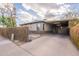 Charming home featuring a carport and a mix of brick and stucco at 660 E 1St Ave, Mesa, AZ 85204