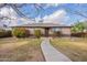 Inviting home featuring a walkway, a well-maintained lawn, and landscaped yard at 660 E 1St Ave, Mesa, AZ 85204