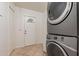 Well-lit laundry room with a stacked washer and dryer and ample space at 660 E 1St Ave, Mesa, AZ 85204