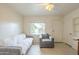 Cozy living room features tile flooring, a couch, chair, and a bright window at 660 E 1St Ave, Mesa, AZ 85204