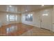 Bright living room featuring wood-look flooring, neutral paint, and plenty of natural light at 660 E 1St Ave, Mesa, AZ 85204