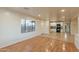 Bright, open-concept living room featuring hardwood floors and a seamless transition to the modern kitchen at 660 E 1St Ave, Mesa, AZ 85204