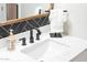 Sleek bathroom sink with a white countertop, stylish faucet, and elegant decorative soap at 7625 E Camelback Rd # A336, Scottsdale, AZ 85251