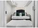 Small bedroom featuring a daybed with a trundle bed and unique woven wall art hanging above at 7625 E Camelback Rd # A336, Scottsdale, AZ 85251