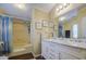 Bathroom featuring a shower, tub combo, and vanity with double sinks at 7807 E Main St # H12, Mesa, AZ 85207