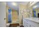Bathroom featuring a shower, tub combo, and vanity with double sinks at 7807 E Main St # H12, Mesa, AZ 85207
