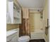 Bathroom featuring a tub, shower, white cabinets and neutral walls at 7807 E Main St # H12, Mesa, AZ 85207