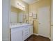 Bathroom featuring a vanity with double sinks and vanity lighting at 7807 E Main St # H12, Mesa, AZ 85207