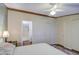Bedroom features a ceiling fan, and access to the bathroom at 7807 E Main St # H12, Mesa, AZ 85207