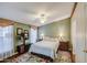 Bedroom with decorative lamps, ceiling fan, and colorful area rug at 7807 E Main St # H12, Mesa, AZ 85207