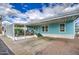 A charming single-story home showcasing a covered carport and pleasant exterior paint at 7807 E Main St # H12, Mesa, AZ 85207