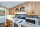 Kitchen showing cabinets, updated countertops and white appliances at 7807 E Main St # H12, Mesa, AZ 85207
