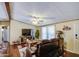 Comfortable living room features a ceiling fan and entertainment center at 7807 E Main St # H12, Mesa, AZ 85207