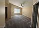 Large bedroom featuring plush carpet, vaulted ceiling, and a window providing natural light at 8179 W Clara Ln, Peoria, AZ 85382