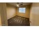 Bedroom featuring a ceiling fan, plush carpet, and a window providing natural light at 8179 W Clara Ln, Peoria, AZ 85382