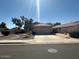 Single-story home featuring a low maintenance front yard and a two car garage at 8179 W Clara Ln, Peoria, AZ 85382