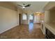Bright living room featuring tile floors, ceiling fan, and neutral walls at 8179 W Clara Ln, Peoria, AZ 85382