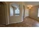 Dining area with decorative lighting and natural light shining through the large window at 8179 W Clara Ln, Peoria, AZ 85382